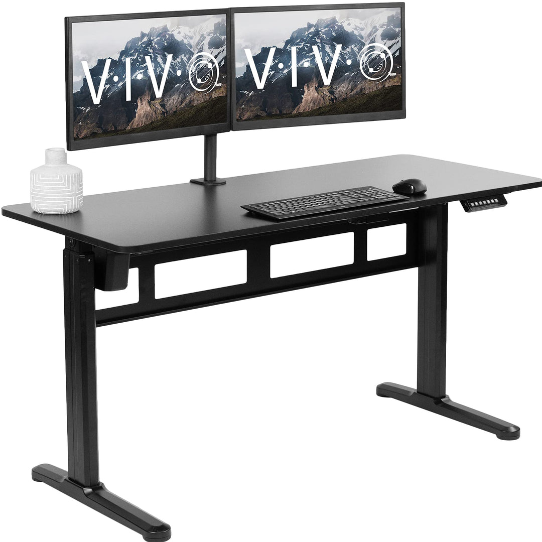 Electric height adjustable standing desk in black with a spacious surface