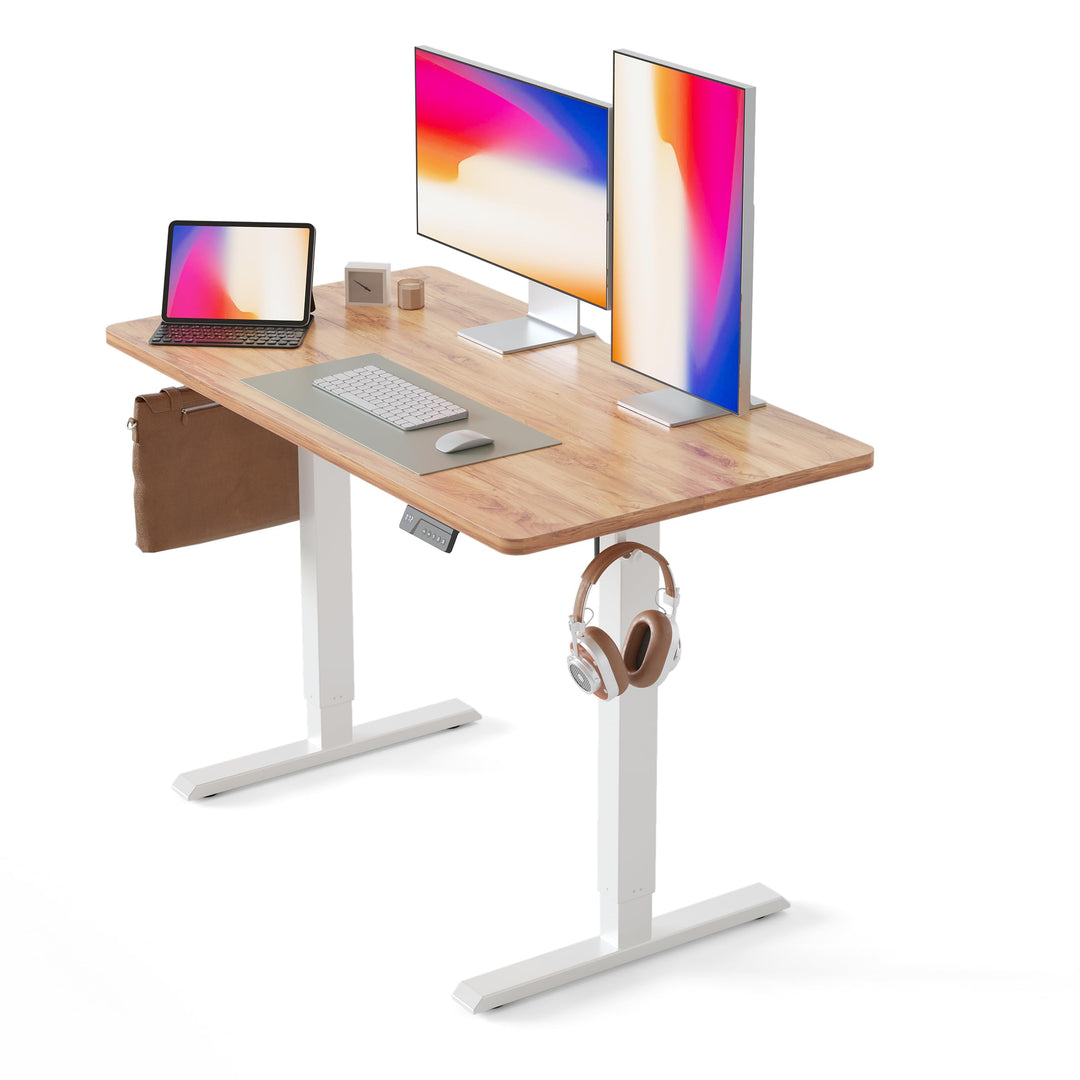 Electric height adjustable standing desk with light brown wood grain surface