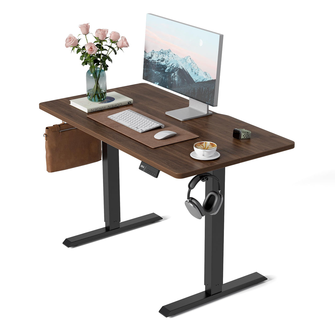 Electric height adjustable standing desk with black walnut wood grain surface